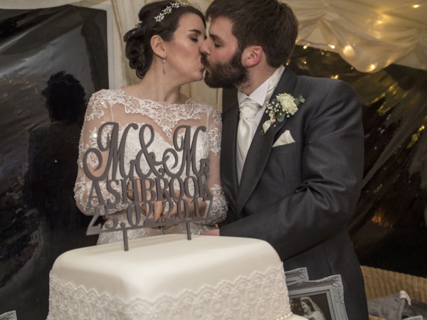 bride and groom cutting the cake, cheshire wedding photographer