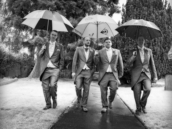 groom and best man, rain, umbrellas, staffordshire wedding photographer, heath house weddings