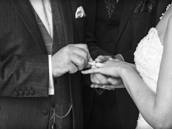 black and white bride and groom giving rings, staffordshire wedding photographer, heath house weddings