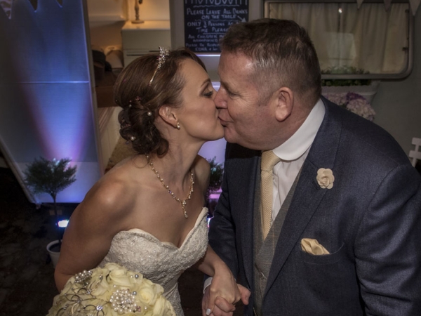 bride and groom kiss with bouquet, staffordshire wedding photographer, heath house weddings