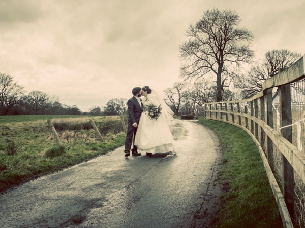 countryside bride and groom kiss, cheshire wedding photographer