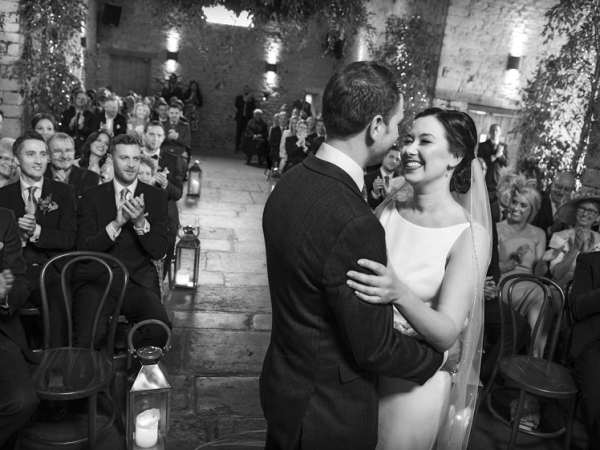 black and white bride and groom first kiss, gloucestershire wedding photographer, cripps barn