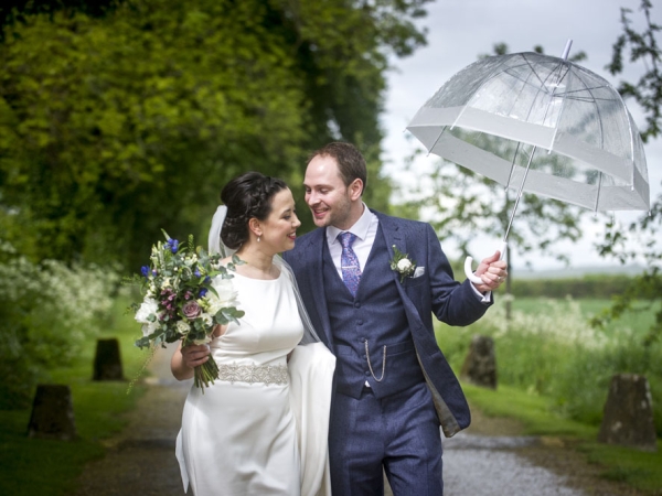 bride and groom umbrella country lane, gloucestershire wedding photographer, cripps barn