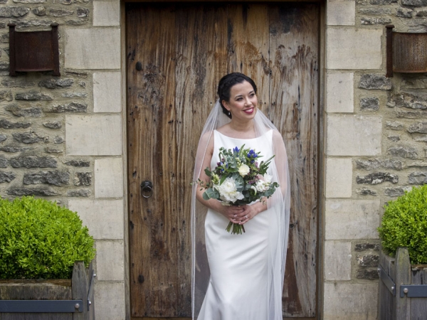 bride holding her bouquet, gloucestershire wedding photographer, cripps barn