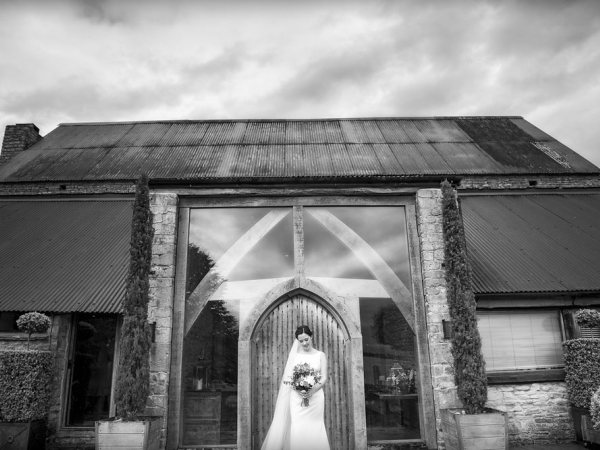 bride holding her bouquet, black and white, gloucestershire wedding photographer, cripps barn