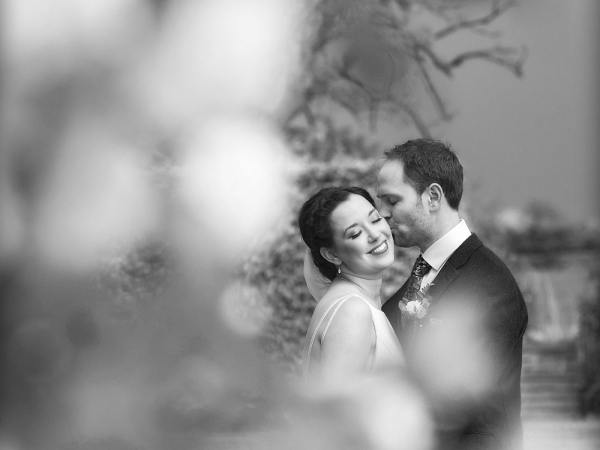 black and white groom and bride kiss, gloucestershire wedding photographer, cripps barn