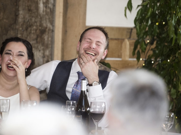 bride and groom laughing during speeches, gloucestershire wedding photographer, cripps barn