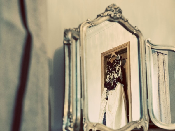 wedding photographer in wales, mirror shot of dress hanging