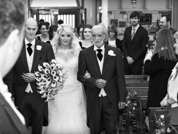 bride walking down the aisle, black and white, cheshire wedding photographer, crewe hall