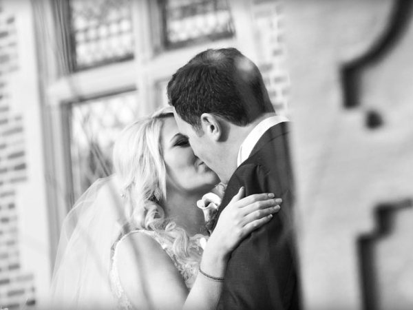 bride and groom kissing, black and white, cheshire wedding photographer, crewe hall