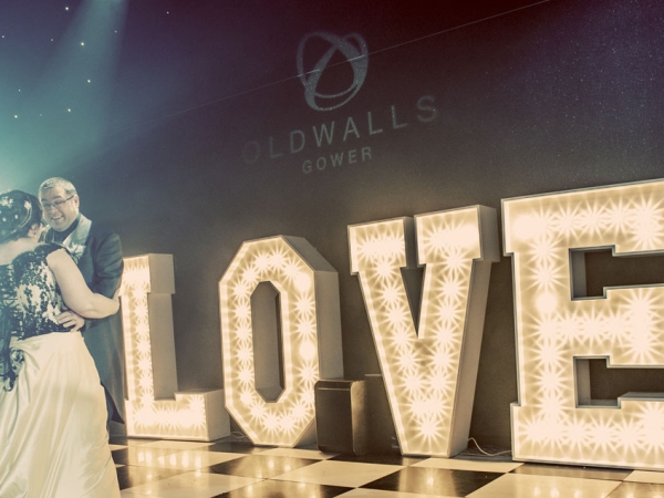 first dance bride and groom, giant love letters, wedding photographer in wales