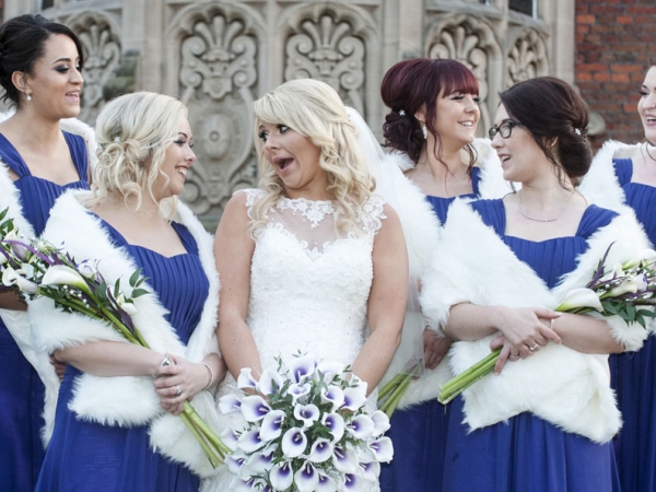 bride laughing with her bridesmaids, cheshire wedding photographer, crewe hall