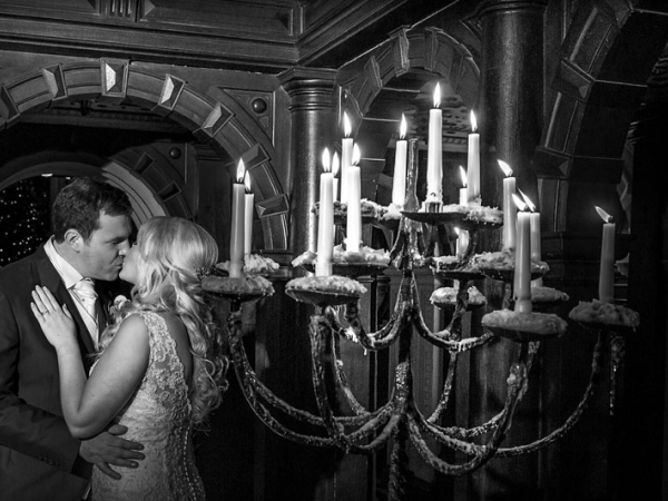 bride and groom kissing by candlelight, cheshire wedding photographer, crewe hall