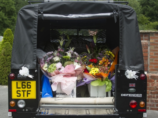 land rover defender filled with flowers, cheshire wedding photographer, sandhole oak barn