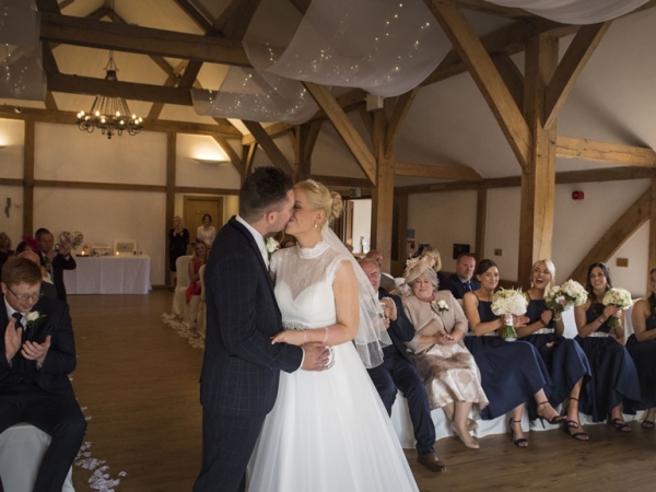 bride and groom first kiss, cheshire wedding photographer, sandhole oak barn