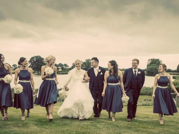 bride, groom, best man and bridesmaids in a line, cheshire wedding photographer, sandhole oak barn
