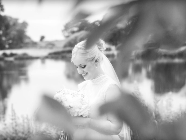black and white, bride holding her bouquet, cheshire wedding photographer, sandhole oak barn