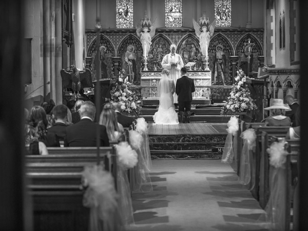 bride and groom kneeling, cheshire wedding photographer, all saints church thelwall
