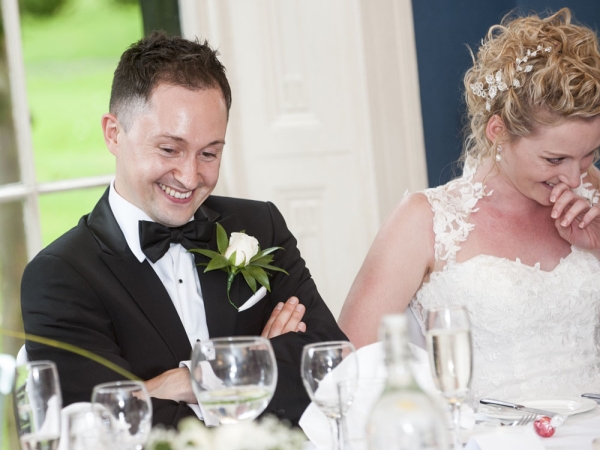 bride and groom laughing during speeches, cheshire wedding photographer, statham lodge hotel