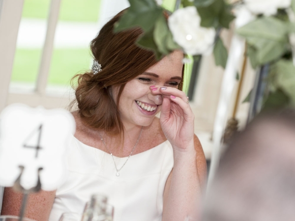 wedding guest laughing during speeches, cheshire wedding photographer, statham lodge hotel