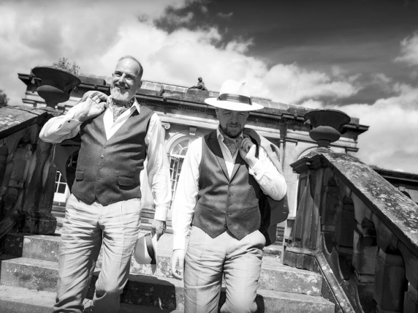 black and white grooms holding hands, staffordshire wedding photographer, heath house weddings