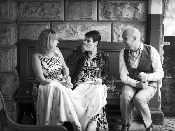 black and white groom and guests laughing, alton station, staffordshire wedding photographer, heath house weddings