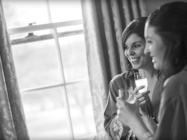 black and white bridesmaids champagne laughing, warwickshire wedding photographer, Ansty Hall