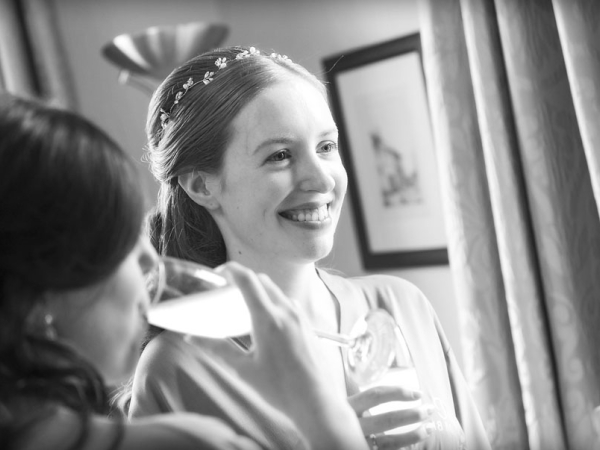 black and white bride and bridesmaids champagne laughing, warwickshire wedding photographer, Ansty Hall