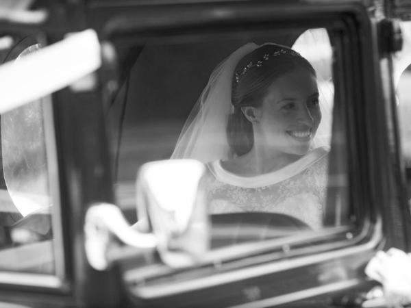 black and white bride arriving in vintage car, warwickshire wedding photographer, Ansty Hall